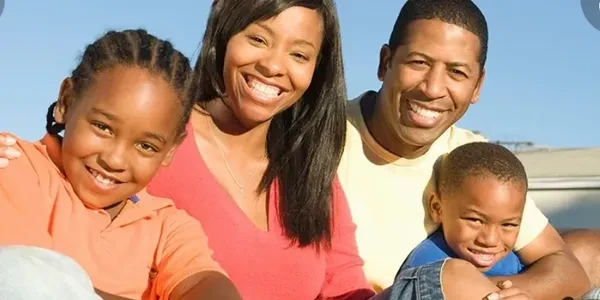 Happy family outdoors — protecting what matters most